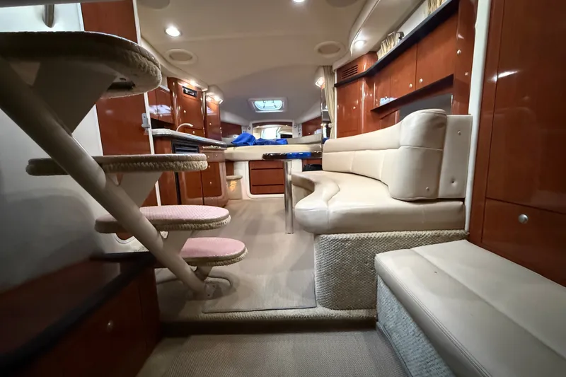 Slide: The Image of 2007 Sea Ray 340 Sundancer interior with plush seating and elegant wood finishes. - 25