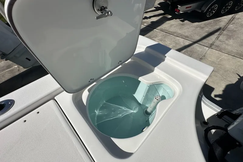 Slide: The Image of Open livewell on 2026 Sea Pro 230 Bay boat, showcasing interior design and functionality. - 15