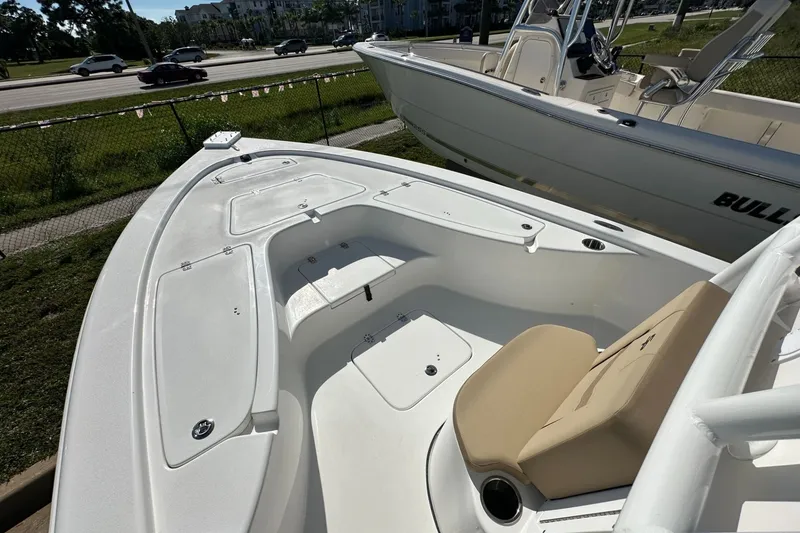 Slide: The Image of 2026 Sea Pro 230 Bay boat with spacious deck and seating area. - 4