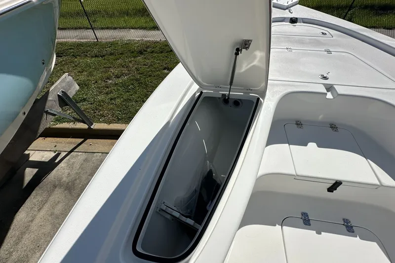 Slide: The Image of Open storage compartment on 2026 Sea Pro 230 Bay boat, showcasing interior space. - 5