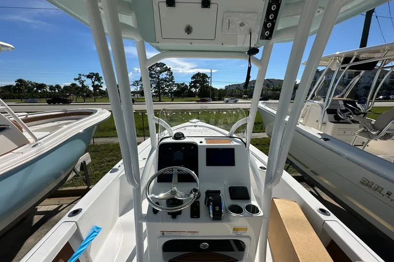 Slide: The Image of 2026 Sea Pro 230 Bay boat interior with steering console and navigation equipment. - 3