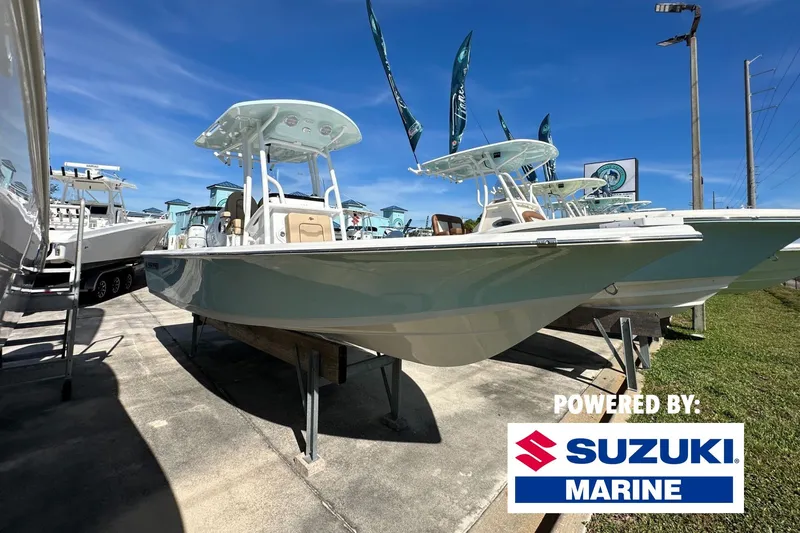 The Image of 2026 Sea Pro 230 Bay boat displayed outdoors, powered by Suzuki Marine. - 0