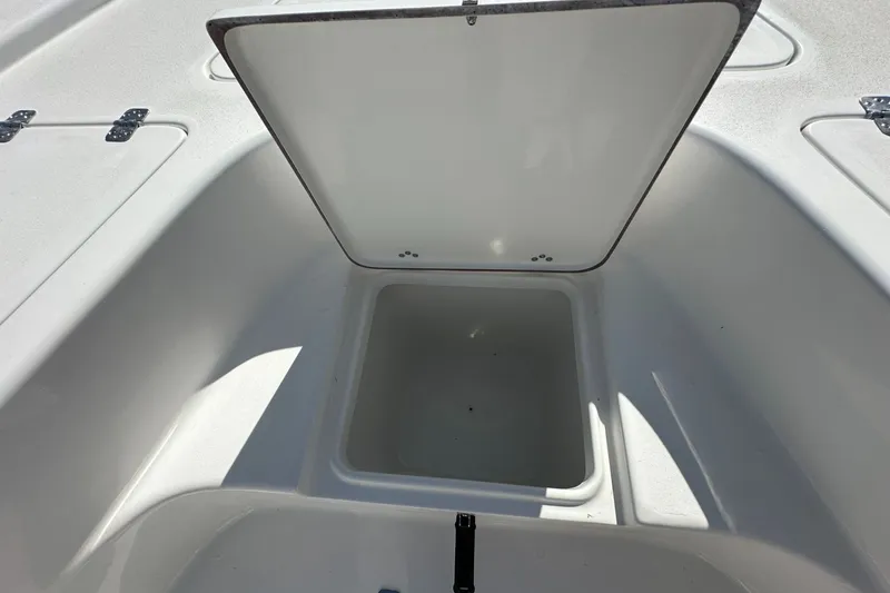 Slide: The Image of Open storage compartment on 2026 Sea Pro 230 Bay boat. - 8