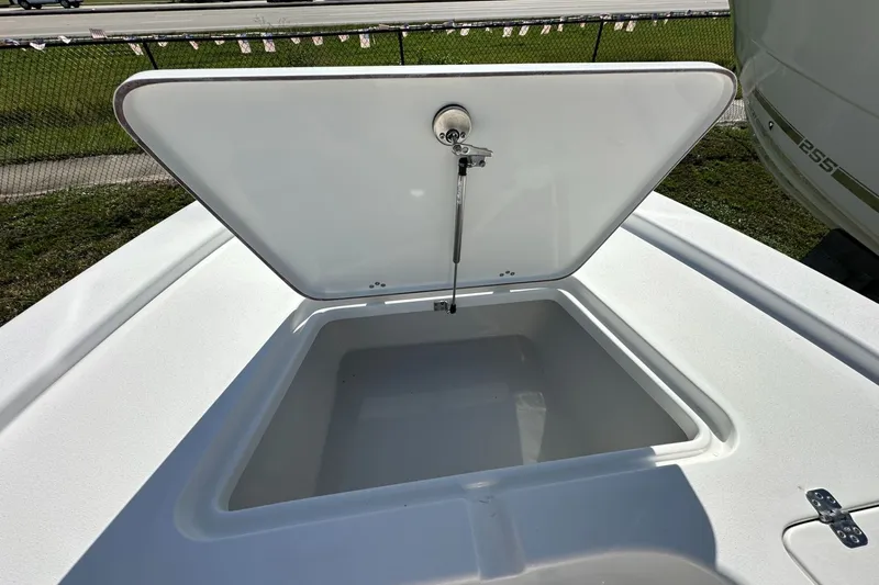 Slide: The Image of Open storage compartment on a 2026 Sea Pro 230 Bay boat. - 6