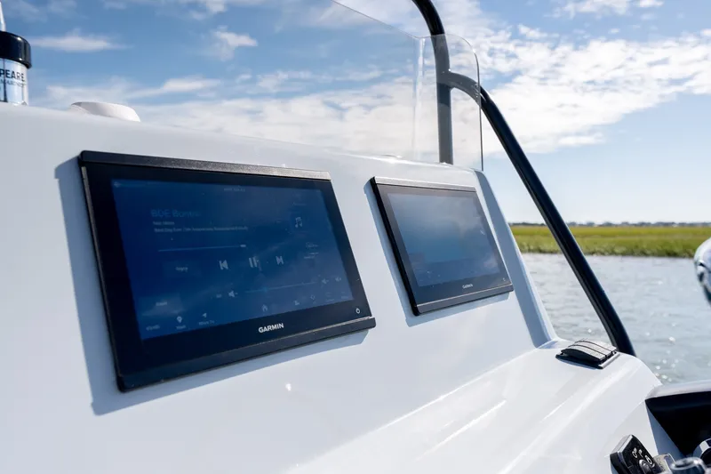 Slide: The Image of 1980 Sea Ox 230 Center Console with Garmin displays on a sunny day. - 20