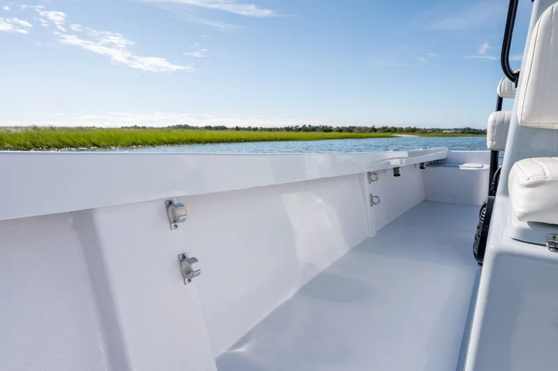 Slide: The Image of 1980 Sea Ox 230 Center Console boat interior with scenic water view. - 25