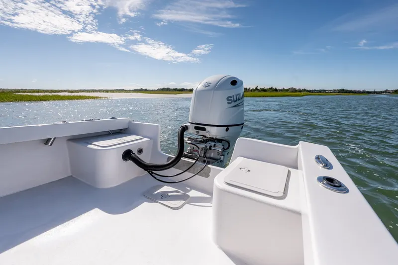 Slide: The Image of 1980 Sea Ox 230 Center Console boat with Suzuki outboard motor on a sunny day. - 26