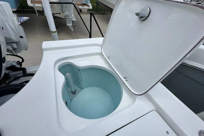 Slide: The Image of Open storage compartment on a 2026 Sea Pro 230 Bay boat, showcasing interior design. - 15