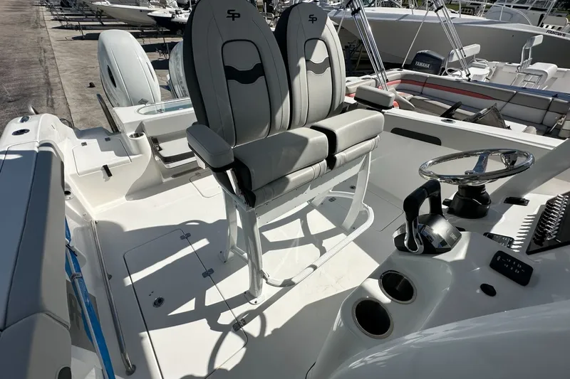 Slide: The Image of 2026 Sea Pro 262 Offshore boat interior with dual seats and steering console. - 9