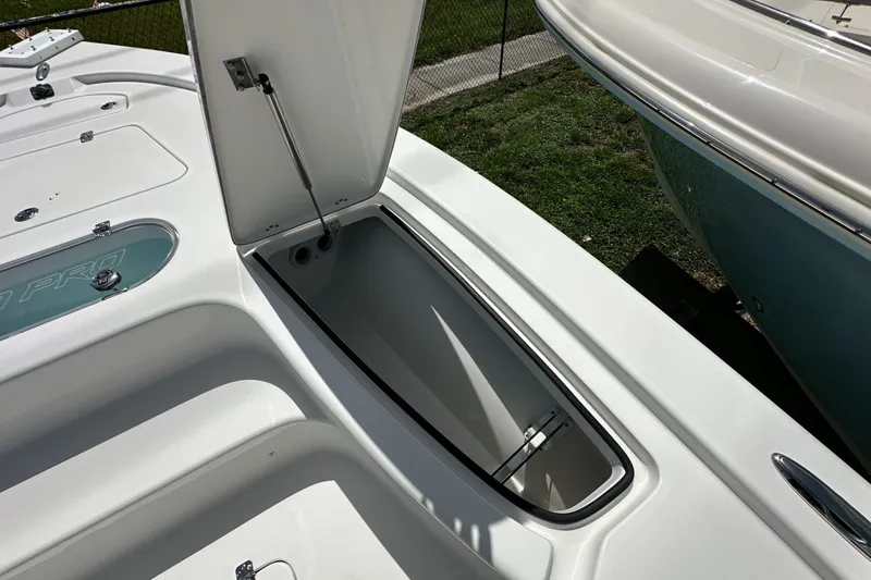 Slide: The Image of Open storage compartment on 2026 Sea Pro 250 Bay boat, showcasing interior space. - 7
