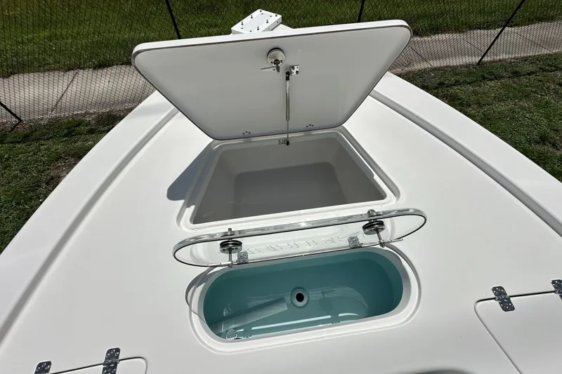 Slide: The Image of Open storage compartments on 2026 Sea Pro 250 Bay boat deck. - 6