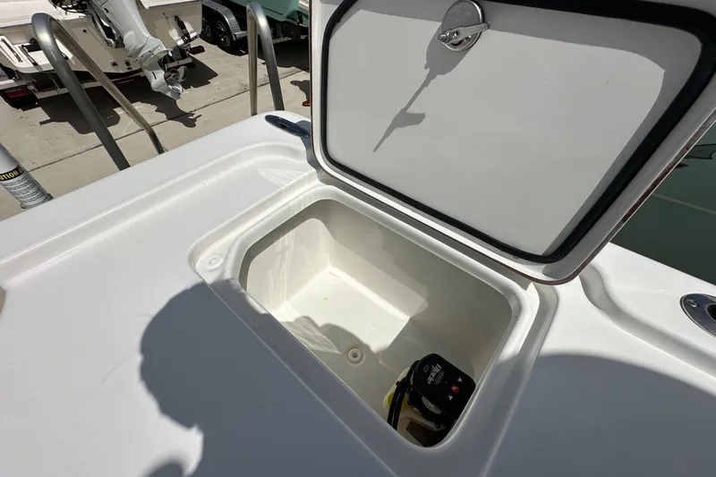 Slide: The Image of Open storage compartment on a 2026 Sea Pro 250 Bay boat, showcasing interior space. - 12