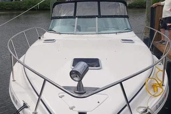 Slide: The Image of 2006 Rinker Fiesta Vee 342 boat docked on a calm waterway. - 1