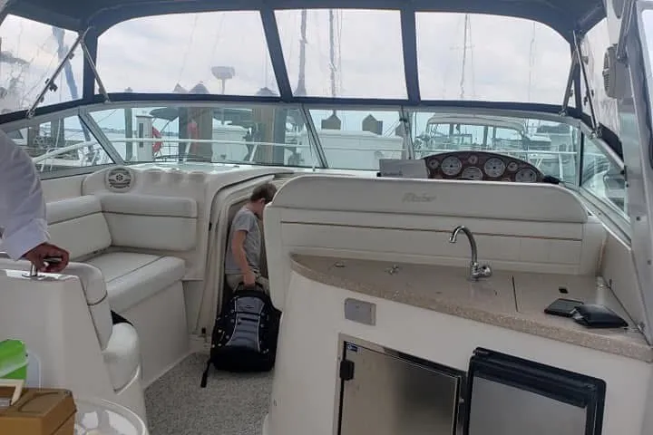 Slide: The Image of Interior of a 2006 Rinker Fiesta Vee 342 boat with seating and kitchenette. - 5