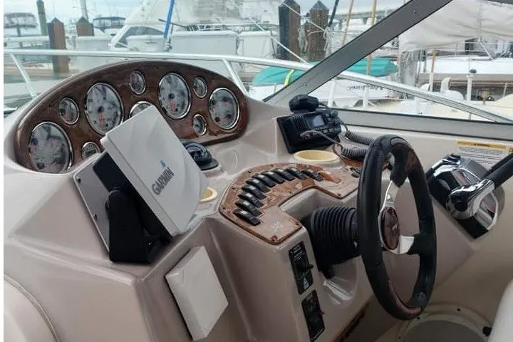 Slide: The Image of 2006 Rinker Fiesta Vee 342 boat dashboard with Garmin navigation system and control panel. - 4