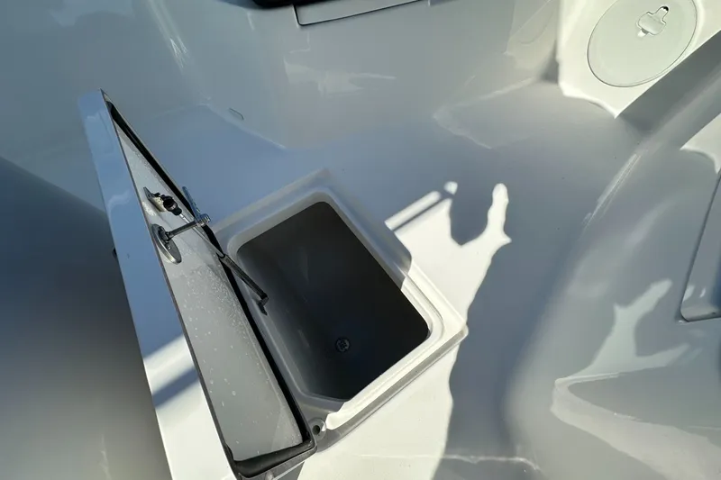 Slide: The Image of Open storage compartment on 2026 Sea Pro 292 DLX boat deck. - 10