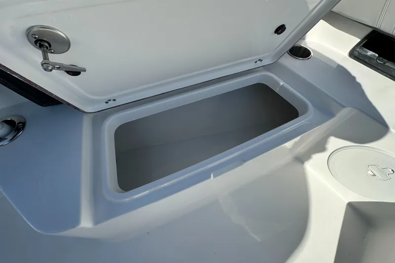 Slide: The Image of Open storage compartment on 2026 Sea Pro 292 DLX boat deck. - 9