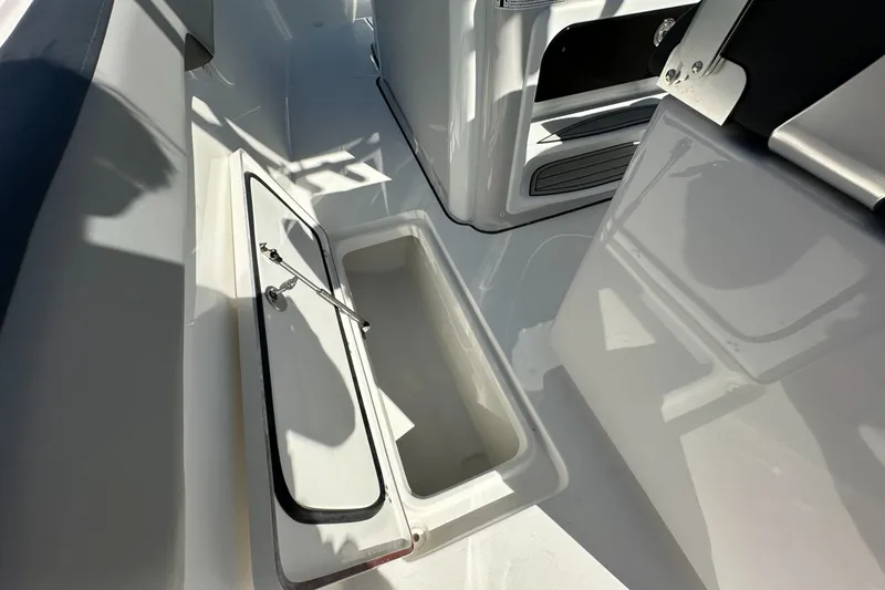 Slide: The Image of 2026 Sea Pro 292 DLX boat interior with open storage compartment. - 15