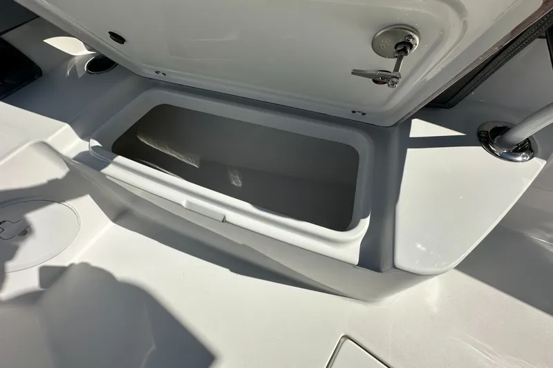 Slide: The Image of Open storage compartment on 2026 Sea Pro 292 DLX boat deck. - 8