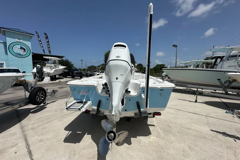 Slide: The Image of 2026 Sea Pro 230 Bay boat displayed outdoors on a sunny day. - 3