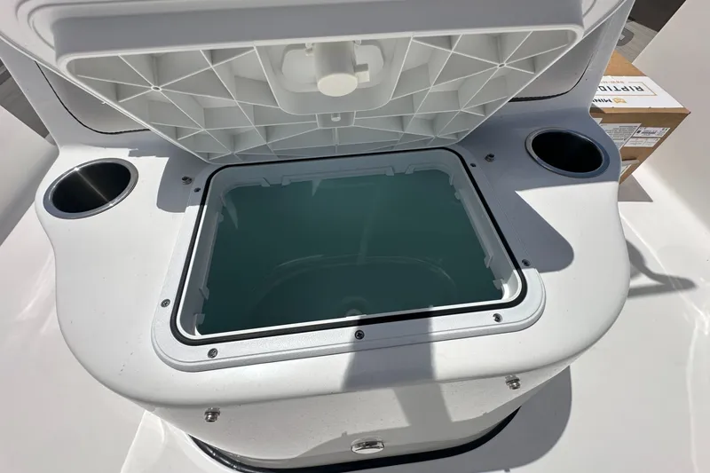 Slide: The Image of 2026 Sea Pro 230 Bay boat livewell with open lid and cup holders. - 11
