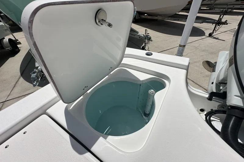 Slide: The Image of Livewell compartment on a 2026 Sea Pro 230 Bay boat, open and ready for use. - 15