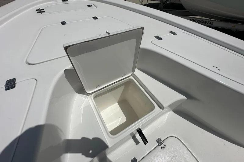 Slide: The Image of Open storage compartment on 2026 Sea Pro 230 Bay boat deck. - 8