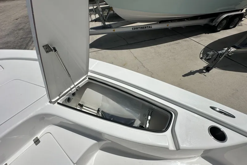 Slide: The Image of Open storage compartment on a 2026 Sea Pro 230 Bay boat, showcasing interior space. - 9