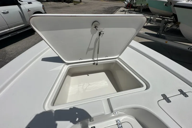 Slide: The Image of Open storage compartment on a 2026 Sea Pro 230 Bay boat, showcasing spacious interior. - 7