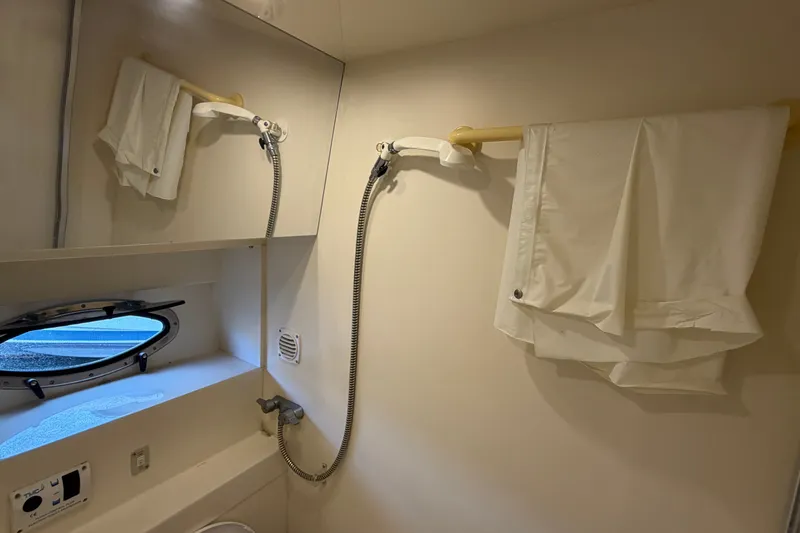 Slide: The Image of Bathroom interior of 1996 Carver 325 Aft Cabin Motor Yacht with shower and porthole. - 21