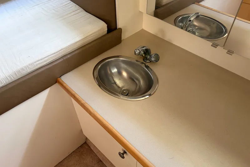 Slide: The Image of Interior of 1996 Carver 325 Aft Cabin Motor Yacht with sink and countertop. - 30