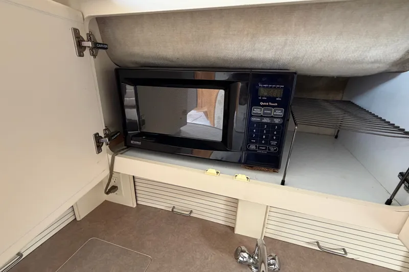Slide: The Image of Microwave in 1996 Carver 325 Aft Cabin Motor Yacht kitchen cabinet. - 22