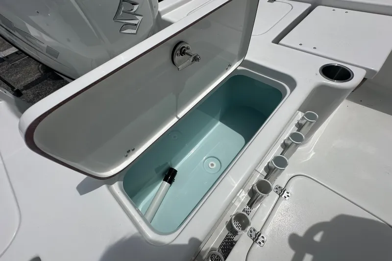 Slide: The Image of Open storage compartment on 2027 Sea Pro 230 Bay boat deck. - 15