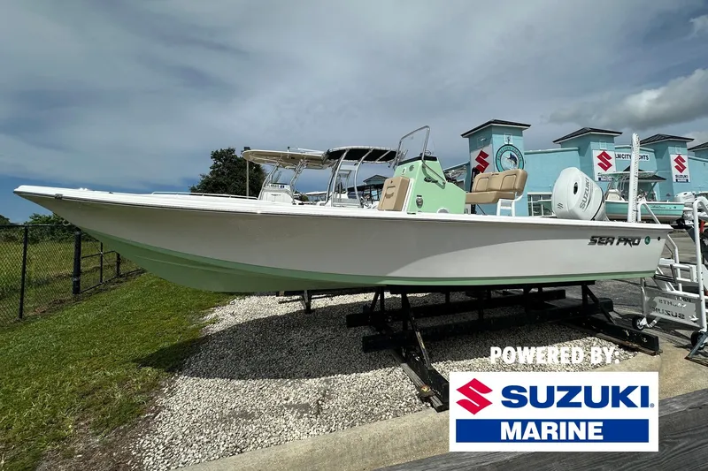 The Image of 2027 Sea Pro 230 Bay boat powered by Suzuki Marine, displayed outdoors. - 0