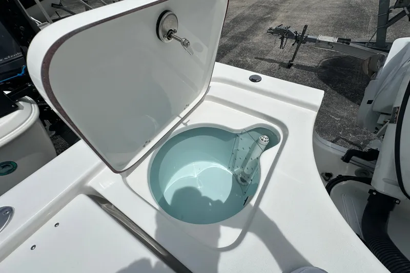 Slide: The Image of Open livewell on 2027 Sea Pro 230 Bay boat, showcasing interior design and functionality. - 17