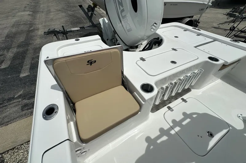 Slide: The Image of 2027 Sea Pro 230 Bay boat interior with seating and storage compartments. - 13