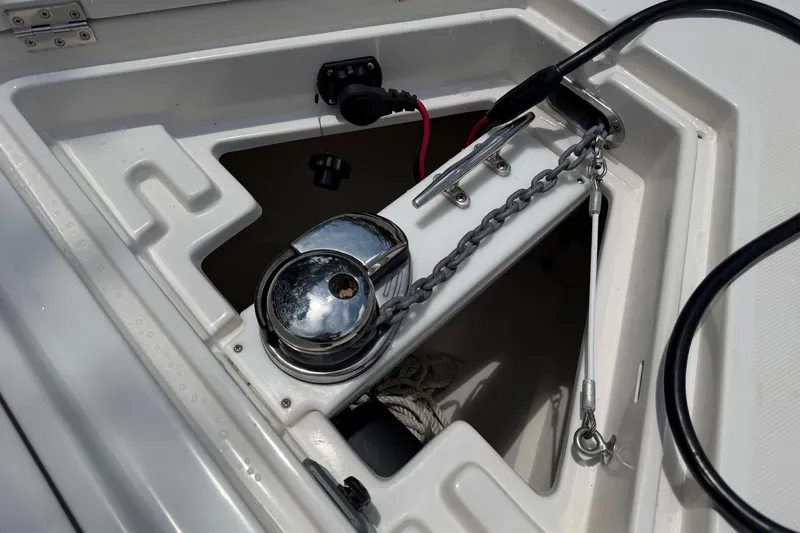Slide: The Image of Anchor windlass system on a 2019 Jupiter 30 boat, featuring chain and cleat. - 28