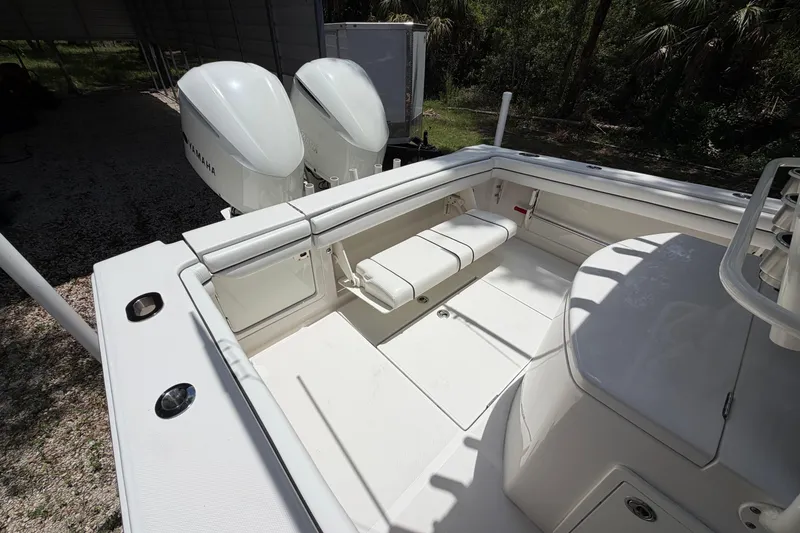 Slide: The Image of 2019 Jupiter 30 boat interior with Yamaha engines, featuring spacious seating and storage. - 33