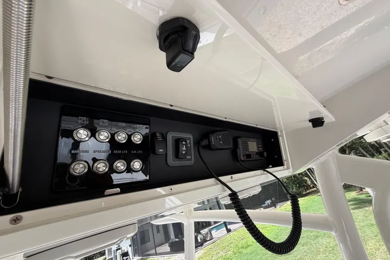 Slide: The Image of Control panel and radio equipment on a 2019 Jupiter 30 boat. - 19