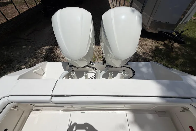 Slide: The Image of Twin outboard engines on a 2019 Jupiter 30 boat, viewed from above. - 35