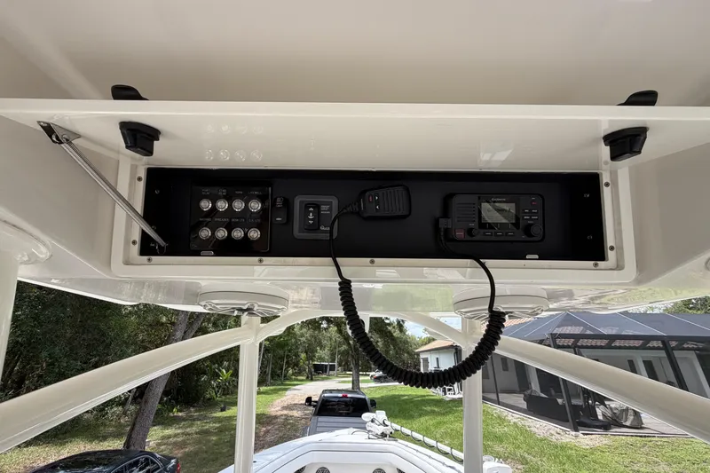 Slide: The Image of 2019 Jupiter 30 boat console with control panel and radio equipment. - 20
