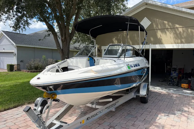 Slide: The Image of 2021 Campion Allante 180 boat on trailer in residential driveway. - 1