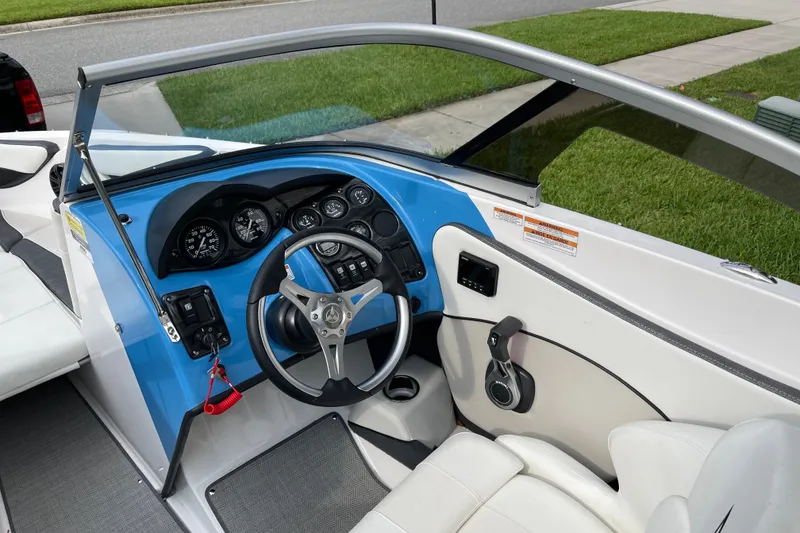 Slide: The Image of 2021 Campion Allante 180 boat dashboard with steering wheel and instrument panel. - 5