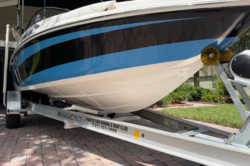 Slide: The Image of 2021 Campion Allante 180 boat on trailer, featuring sleek black and blue design. - 10
