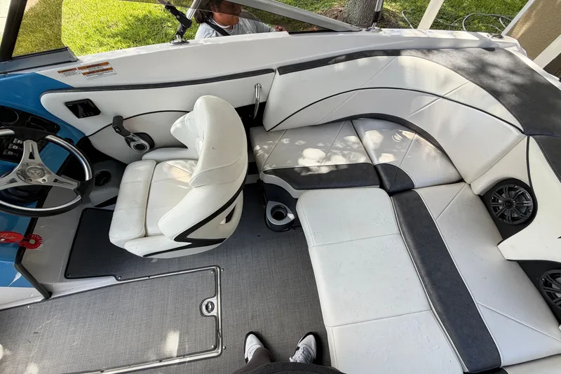 Slide: The Image of Interior of 2021 Campion Allante 180 boat with white seating and steering wheel. - 14
