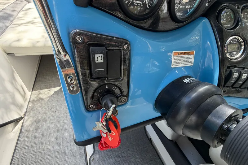 Slide: The Image of 2021 Campion Allante 180 dashboard with ignition keys and control panel. - 21