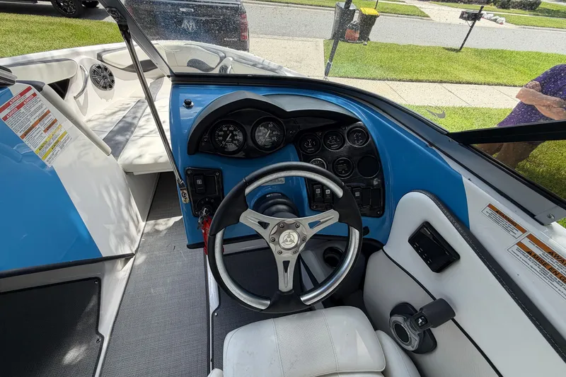 Slide: The Image of Interior view of 2021 Campion Allante 180 boat cockpit with steering wheel and dashboard. - 17