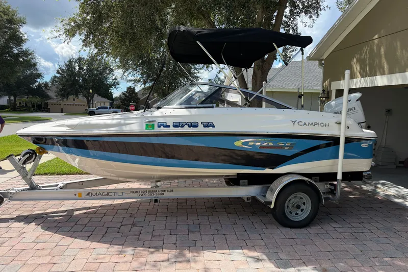 The Image of 2021 Campion Allante 180 boat on trailer, parked in a residential driveway. - 0