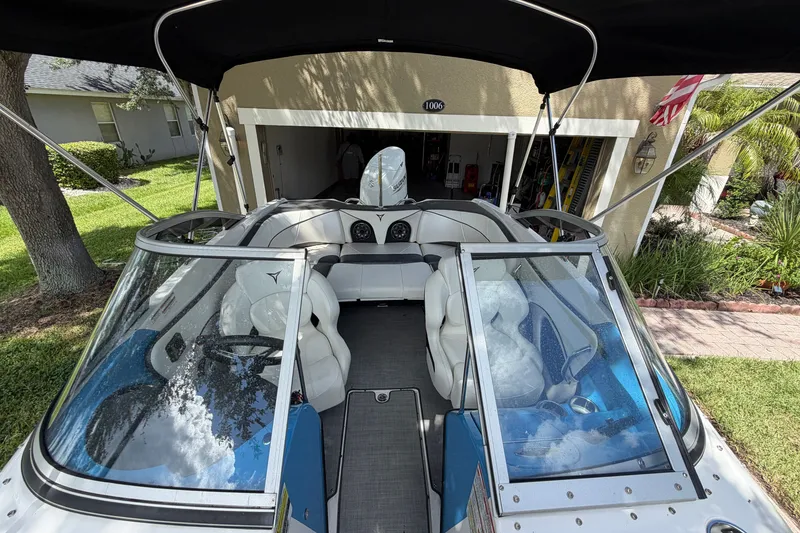 Slide: The Image of 2021 Campion Allante 180 boat parked in a driveway, showcasing sleek interior design. - 34