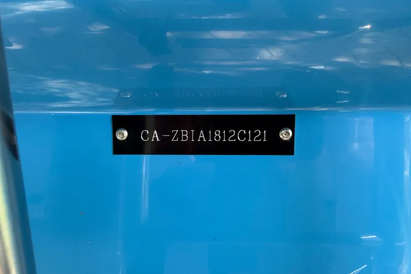 Slide: The Image of 2021 Campion Allante 180 boat hull identification number on blue surface. - 26